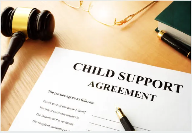 Child support agreement paperwork on a desk.